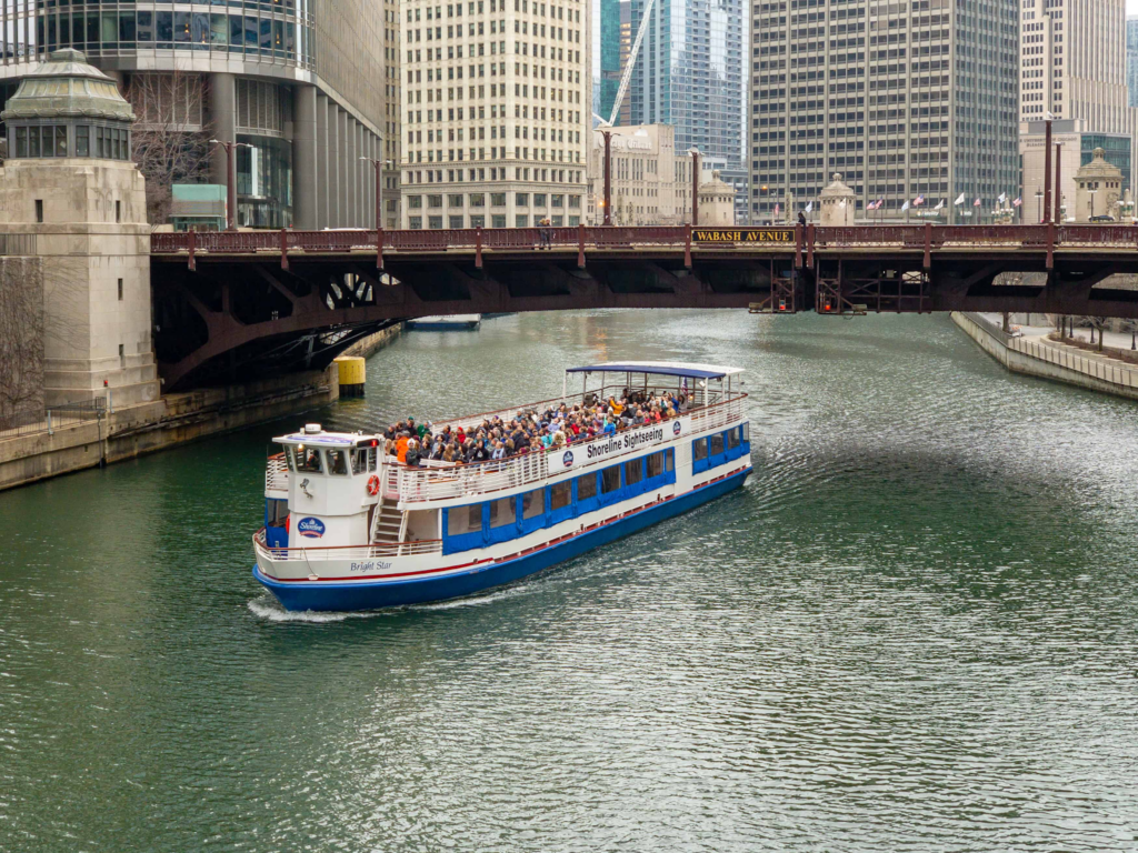 Water taxi passing over the bridge